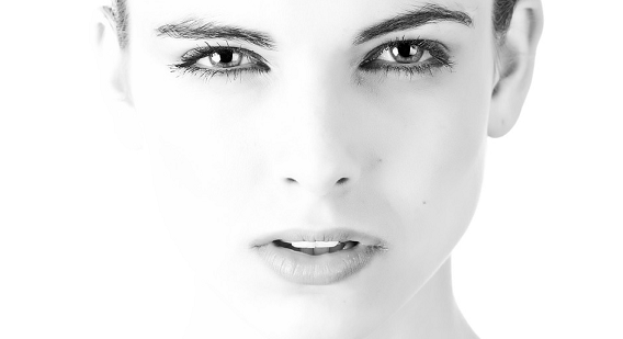 Close up picture of a woman in black and white.